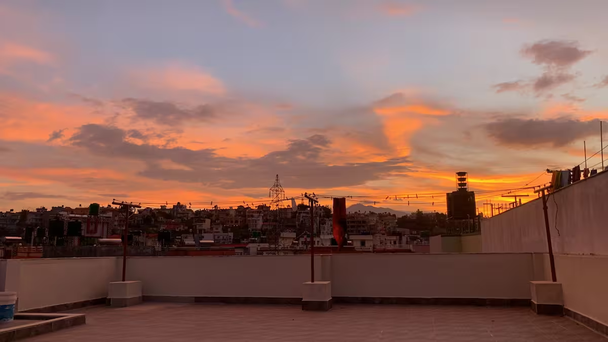 Rooftop terrace with sunset view over Kathmandu